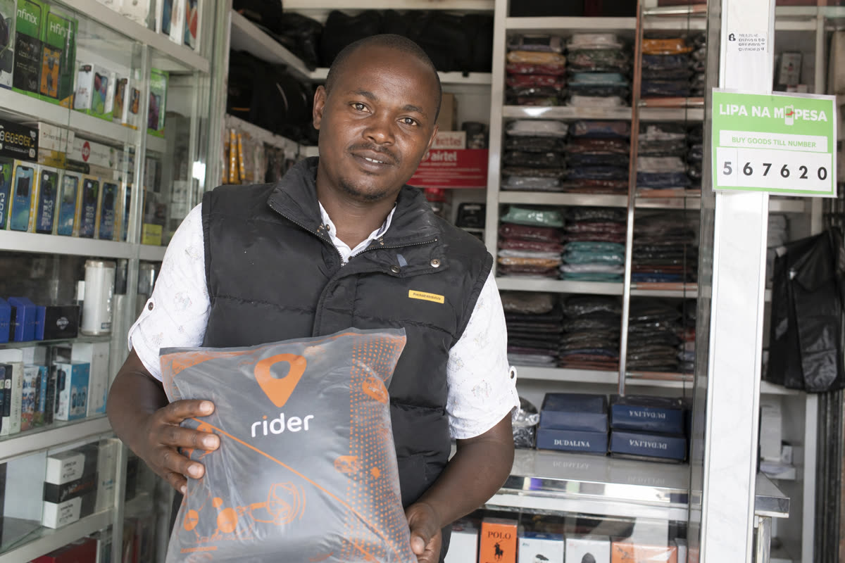 Shopkeeper holding a parcel ready for pickup