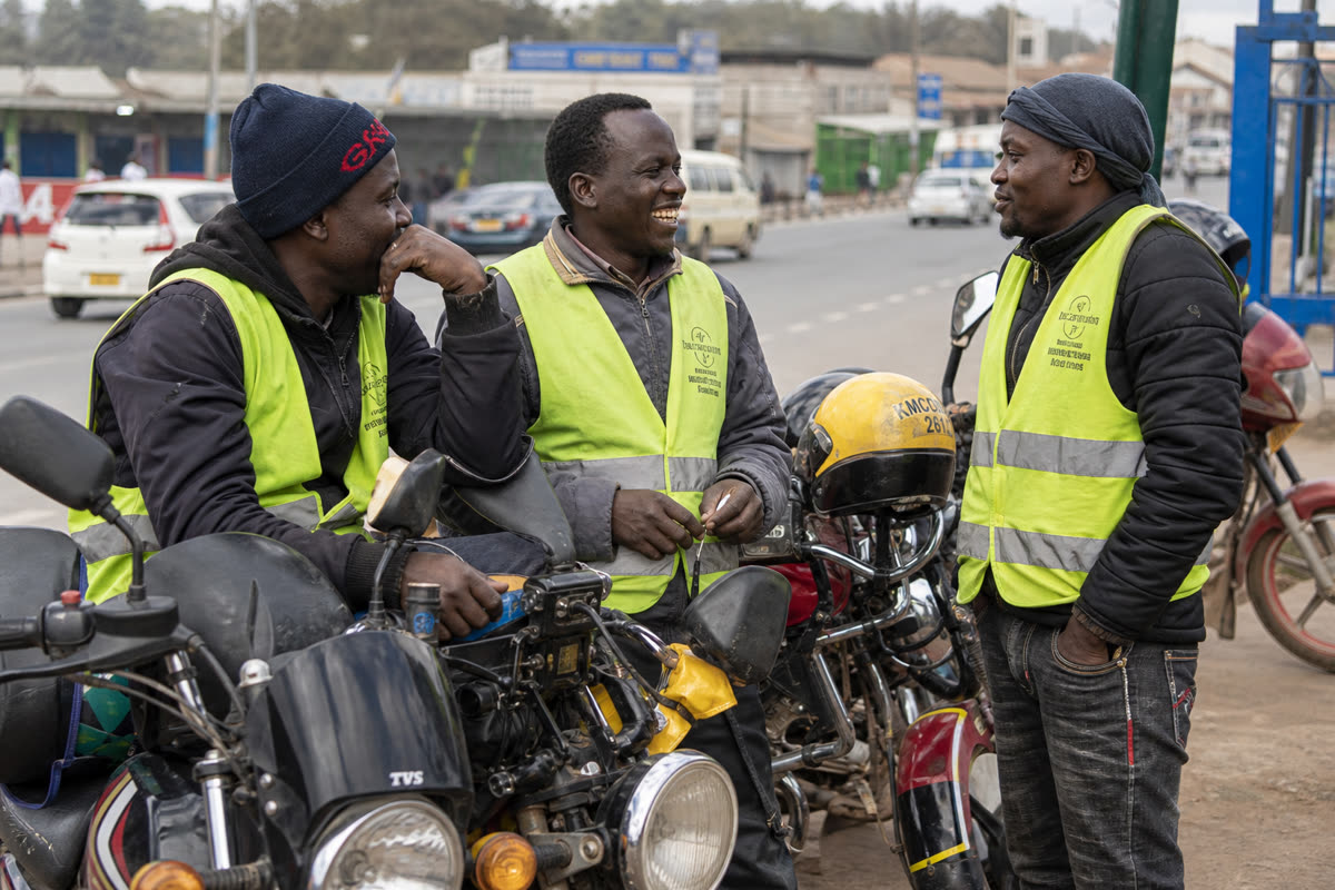 Riders chatting near parked motorcycles